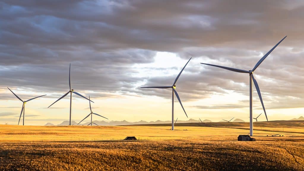 Row of windmills generating electricity on the Canadian prairies